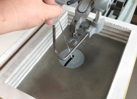 Unloading the blade so you can remove the book stack