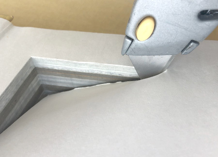Cutting the top endpaper to reveal the cavity