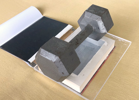 Weighing down the book