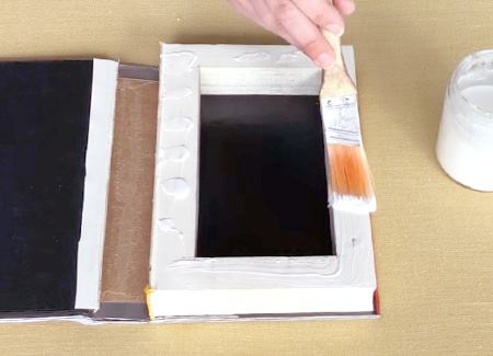 Painting glue on the top of the page block