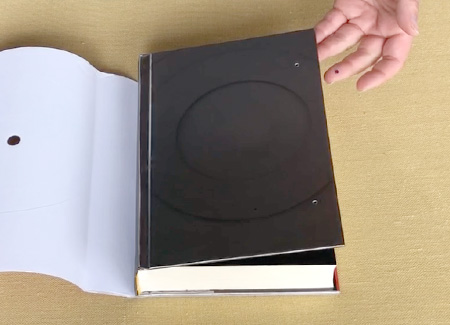 Placing the top magnets into the cover holes